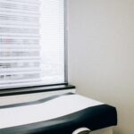 a hospital room with a bed and a window